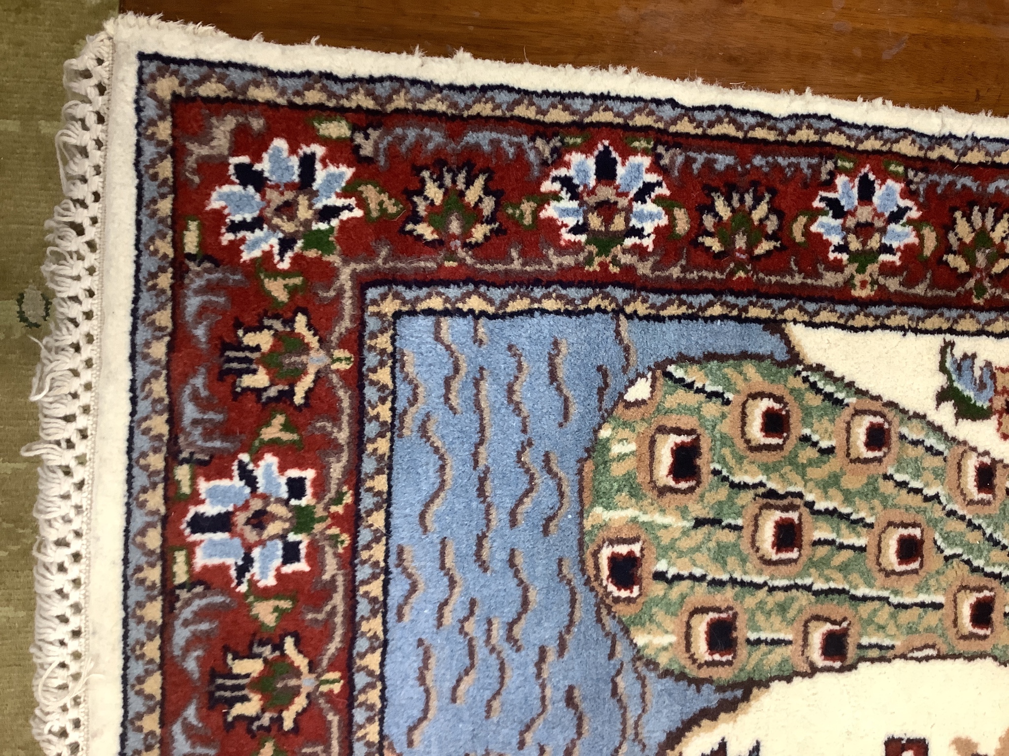 A Tabriz ivory ground 'Peacock' rug, 122 x 120cm